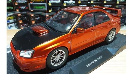 SOLIDO 1/18 - SUBARU IMPREZA WRX STII - 2003 - METALLIC ORAN