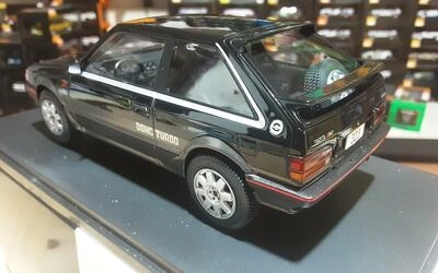 WHITEBOX 1/24 -  MAZDA 323 4WD TURBO - BLACK METALLIC / DARK