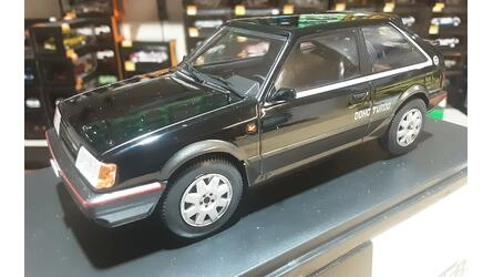 WHITEBOX 1/24 -  MAZDA 323 4WD TURBO - BLACK METALLIC / DARK